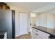 Modern kitchen with white cabinets, granite countertops, and stainless steel appliances at 11058 Grange Creek Dr, Thornton, CO 80233