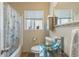 Updated bathroom features a tub and shower, a glass vessel sink and updated fixtures at 6751 Locust St, Commerce City, CO 80022