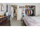 Cozy bedroom with closet and views to the bathroom and other bedroom at 6751 Locust St, Commerce City, CO 80022