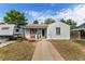 Charming home with a well-maintained front yard and camper parked in the driveway at 6751 Locust St, Commerce City, CO 80022