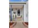 Cozy front porch with stylish number post, plants, and 'Welcome' mat at 6751 Locust St, Commerce City, CO 80022
