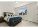 Serene bedroom with a large window, plush bedding, and a calming color scheme at 7875 Yampa River Ave, Littleton, CO 80125