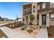 Townhome exterior showcasing landscaping and front entrance at 7875 Yampa River Ave, Littleton, CO 80125