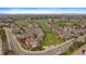 Expansive aerial view of residential area and surrounding green spaces, ideal for community living at 8615 W Berry Ave # 204, Littleton, CO 80123