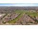 Aerial view of community with lush green spaces, athletic fields, and well-maintained landscaping at 8615 W Berry Ave # 204, Littleton, CO 80123