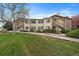 Attractive condo with landscaped front lawn and stairway access to the second-story units at 8615 W Berry Ave # 204, Littleton, CO 80123