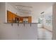 Well-lit kitchen featuring stainless steel appliances and counter seating, perfect for casual dining at 8615 W Berry Ave # 204, Littleton, CO 80123