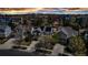 Gorgeous aerial shot of the neighborhood showcasing rooftops, solar panels, landscaping, and inviting street appeal at 25245 E Park Crescent Dr, Aurora, CO 80016
