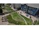 Aerial shot of a backyard with stone landscaping, grass, patio, and wooden fence at 25245 E Park Crescent Dr, Aurora, CO 80016