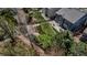 Backyard boasts a well-manicured lawn, stone landscaping, a brick patio, and a wooden fence at 25245 E Park Crescent Dr, Aurora, CO 80016