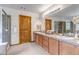Spacious bathroom features a double sink vanity with stylish fixtures and a separate shower at 25245 E Park Crescent Dr, Aurora, CO 80016