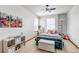 Cozy bedroom decorated with floral artwork, a plush bed, and stylish decor, creating a charming and inviting space at 25245 E Park Crescent Dr, Aurora, CO 80016