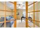 Bedroom featuring light-colored walls, a ceiling fan, and double doors, offering a bright and airy space at 25245 E Park Crescent Dr, Aurora, CO 80016