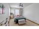Comfortable bedroom with natural light, a ceiling fan, and simple decor, offering a peaceful retreat at 25245 E Park Crescent Dr, Aurora, CO 80016