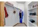 Organized closet with shelving and hanging space, providing ample storage for clothes and accessories at 25245 E Park Crescent Dr, Aurora, CO 80016