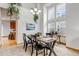 This is a carpeted dining area with large windows and plants hanging from the ceiling at 25245 E Park Crescent Dr, Aurora, CO 80016
