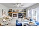 Inviting living room features a cozy fireplace, built-in shelving, and comfortable seating at 25245 E Park Crescent Dr, Aurora, CO 80016