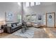 The open-concept living room boasts high ceilings and plenty of natural light at 25245 E Park Crescent Dr, Aurora, CO 80016