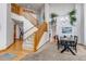 The staircase features wood railings and large windows at 25245 E Park Crescent Dr, Aurora, CO 80016