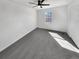 Bright bedroom with a ceiling fan, plush carpeting, and a window offering natural light at 1622 S Idalia Cir # G, Aurora, CO 80017