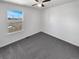 Bright bedroom with a large window offering natural light and scenic views of the neighborhood at 1622 S Idalia Cir # G, Aurora, CO 80017