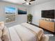 Comfortable bedroom with a ceiling fan, large window, and modern decor creating a relaxing retreat at 1622 S Idalia Cir # G, Aurora, CO 80017
