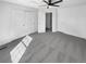 Spacious bedroom featuring plush carpeting, a ceiling fan, and a large closet with sliding doors at 1622 S Idalia Cir # G, Aurora, CO 80017