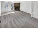 Spacious living room featuring a stone fireplace and neutral carpet, ready for personal touches at 1622 S Idalia Cir # G, Aurora, CO 80017
