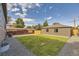 Beautiful backyard with new grass and a wood fence and stone area at 1640 Iola St, Aurora, CO 80010