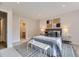 Comfortable bedroom with neutral decor, side tables, and ample natural light at 1640 Iola St, Aurora, CO 80010