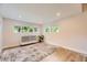 Bright bedroom with modern flooring, stylish rug and ample natural light at 1640 Iola St, Aurora, CO 80010