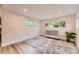 Bright bedroom with modern flooring, stylish rug and ample natural light at 1640 Iola St, Aurora, CO 80010
