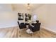 Dining area with round table and chairs and modern lighting at 1640 Iola St, Aurora, CO 80010