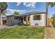 Quaint home with gray paint, green lawn, and tasteful updates at 1640 Iola St, Aurora, CO 80010