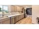 Modern kitchen featuring stainless steel appliances, quartz countertops, and stylish fixtures at 1640 Iola St, Aurora, CO 80010