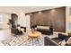 Stylish living room features trendy decor, modern furniture, and plenty of natural light at 1640 Iola St, Aurora, CO 80010