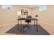 Finished basement office space features modern desk with steel legs and neutral decor at 1640 Iola St, Aurora, CO 80010