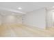 Spacious basement with neutral carpet, recessed lighting, and access to other rooms at 427 S Parkside Dr, Longmont, CO 80501