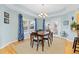 Cozy dining area with modern chandelier and views of the backyard at 427 S Parkside Dr, Longmont, CO 80501