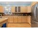 Well-equipped kitchen featuring wood cabinets and stainless steel appliances at 427 S Parkside Dr, Longmont, CO 80501