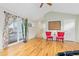 Spacious living room with hardwood floors and sliding door to the balcony at 427 S Parkside Dr, Longmont, CO 80501