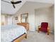 Bright main bedroom featuring a ceiling fan, neutral walls, and carpet at 427 S Parkside Dr, Longmont, CO 80501