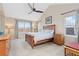 Spacious main bedroom with cathedral ceiling, large windows, and wooden furniture at 427 S Parkside Dr, Longmont, CO 80501