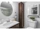 Bathroom with a vanity, toilet, and linen cabinet at 857 S Van Gordon E104 Ct # E104, Lakewood, CO 80228