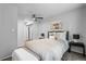 Bright bedroom with mirrored closet doors and ceiling fan at 857 S Van Gordon E104 Ct # E104, Lakewood, CO 80228