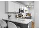 Modern kitchen with stainless steel appliances and breakfast bar at 857 S Van Gordon E104 Ct # E104, Lakewood, CO 80228