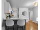 Modern kitchen with white cabinets and breakfast bar at 857 S Van Gordon E104 Ct # E104, Lakewood, CO 80228