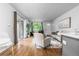 Living room with hardwood floors and access to patio at 857 S Van Gordon E104 Ct # E104, Lakewood, CO 80228