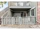 Private patio with access from sliding glass door, small fenced area at 857 S Van Gordon E104 Ct # E104, Lakewood, CO 80228