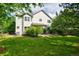Green backyard with a lawn, trees, shrubs and a patio area at 10356 Lions Heart, Lone Tree, CO 80124